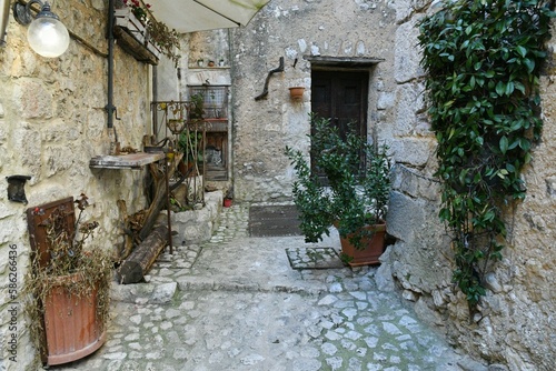 Fototapeta Naklejka Na Ścianę i Meble -  A narrow street among the old houses of Fumone, a historic town in the state of Lazio in Italy.