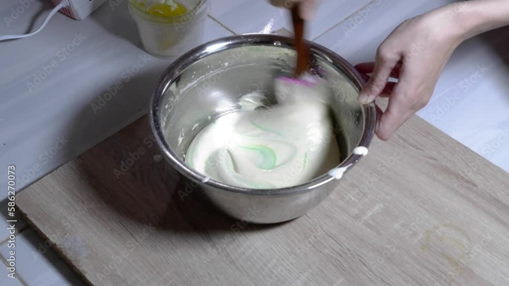 Stir the cake dough using a mixer in a metal bowl Stir the cake dough using a mixer in a metal bowl