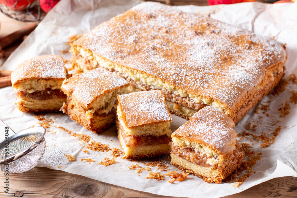 Clasic sponge cake, selective focus. Homemade pie on wooden background