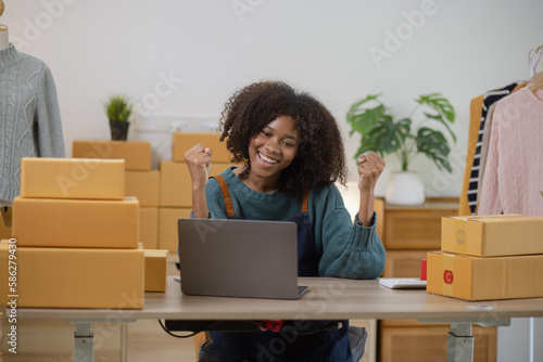 Young African American woman and online selling at home office, Startup small business owner working Online selling and product order for delivery to customer. © SOMKID