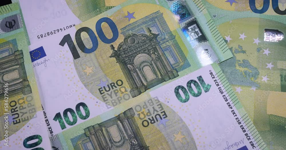 100 euro banknotes closeup. 100€ is one of the higher value euro banknotes used since the introduction of the euro in 2002. Wealth, finance, business, currency exchange, invest, banking concept. 4k 100 euro banknotes closeup. 100€ is one of the higher value euro banknotes used since the introduction of the euro in 2002. Wealth, finance, business, currency exchange, invest, banking concept. 4k