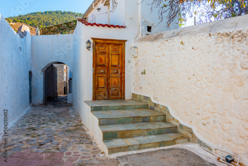 Fototapeta Naklejka Na Ścianę i Meble -  Summer day on a street in Greek town Hydra