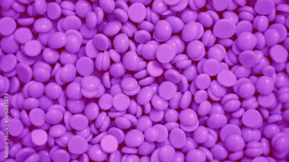 Wax granules for depilation. Background wax texture. Epilation, depilation, removal of unwanted hair. Rotation. View from above. High quality 4k footage Wax granules for depilation. Background wax texture. Epilation, depilation, removal of unwanted hair. Rotation. View from above. High quality 4k footage