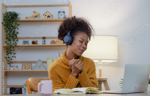 Young African American businesswoman working on at home, Communicating and video conferencing with laptop computer concept, online education.