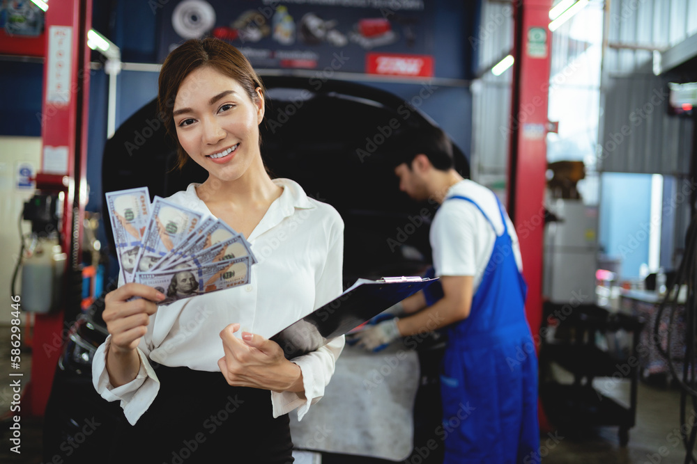 Portrait Asian female clients checking care services and repair cars in auto repair garage Portrait Asian female clients checking care services and repair cars in auto repair garage