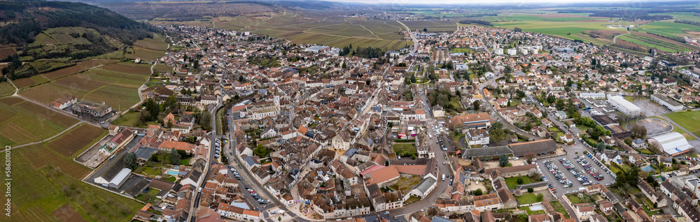 Aerial around the city Nuits-Saint-Georges in France on a morning in late winter.