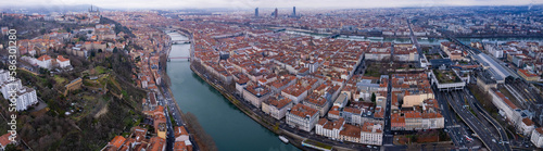 Aerial around the old town of the city Lyon in France on a cloudy afternoon in late winter