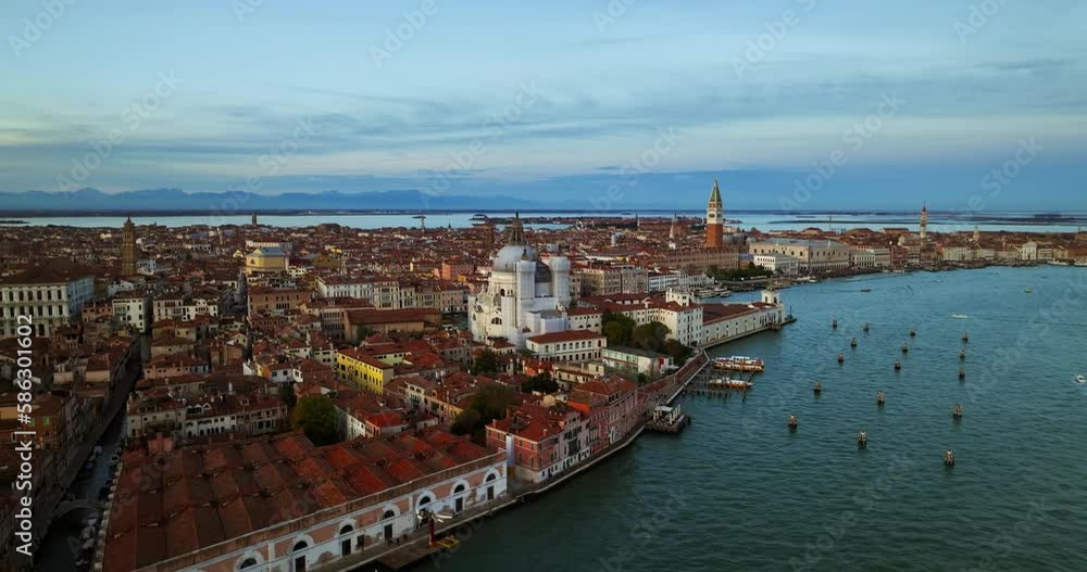Aerial view of Venice, Italy. Canals and gondolas on lagoon. Panorama City skyline during summer sunset over buildings and Basilica's Aerial view of Venice, Italy. Canals and gondolas on lagoon. Panorama City skyline during summer sunset over buildings and Basilica's