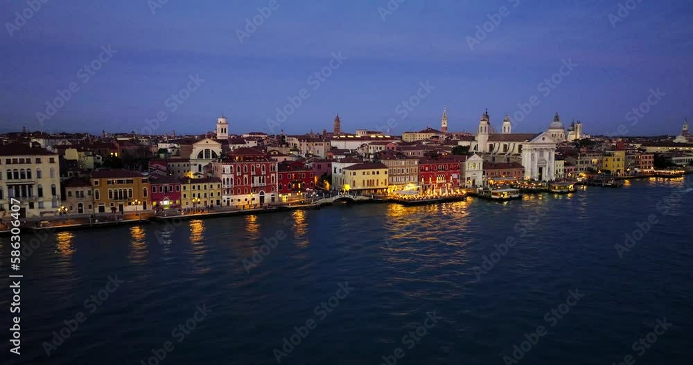 Aerial view of Venice, Italy. Canals and gondolas on lagoon. Panorama City skyline during summer sunset over buildings and Basilica's Aerial view of Venice, Italy. Canals and gondolas on lagoon. Panorama City skyline during summer sunset over buildings and Basilica's