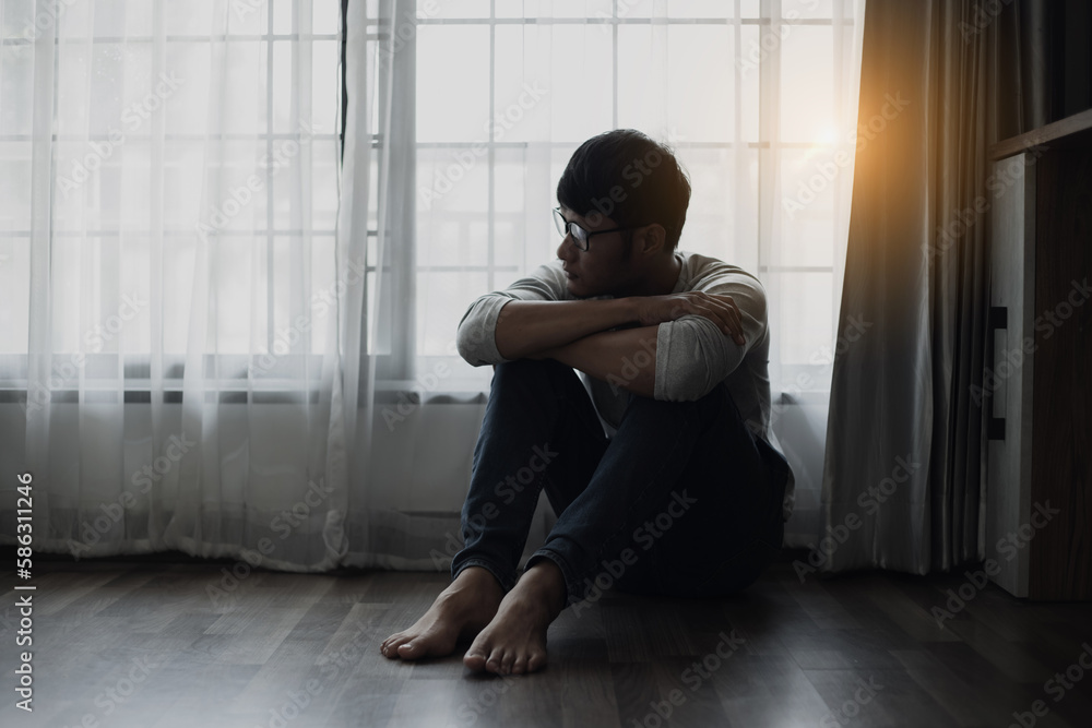 Sad young man in the bedroom, People with depression concept. Sad young man in the bedroom, People with depression concept.
