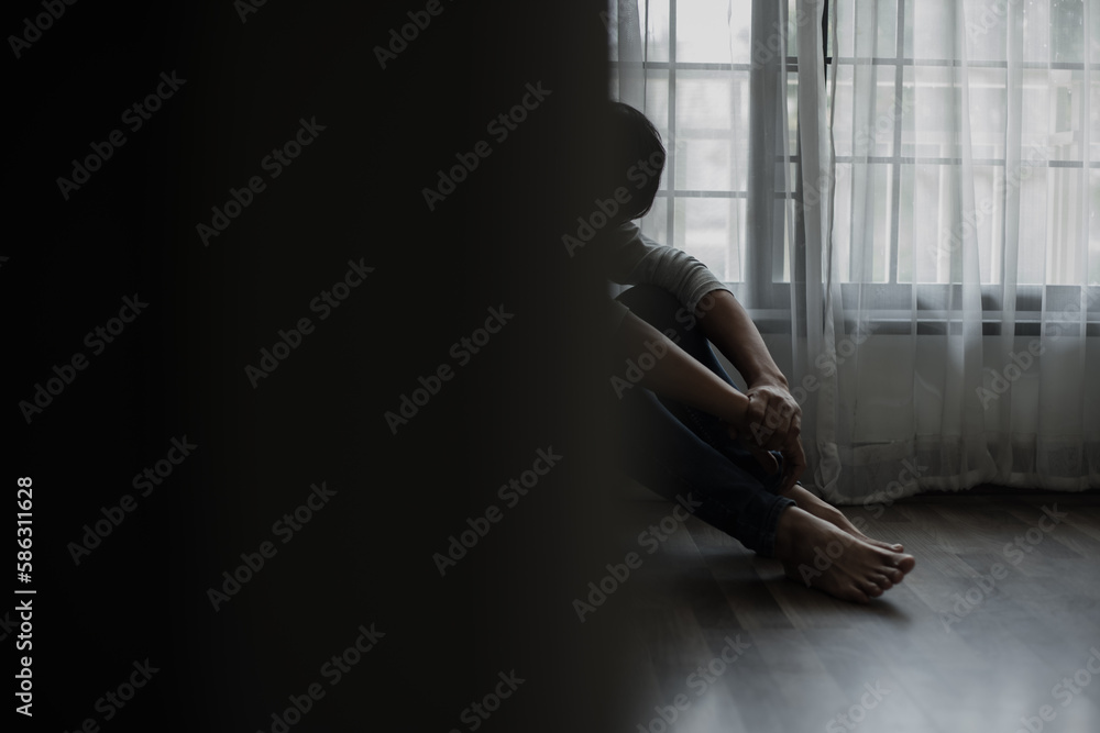 Sad young man in the bedroom, People with depression concept.	