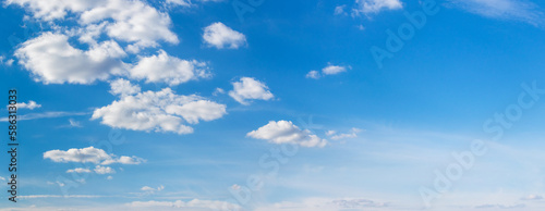 Blue sky with small white cumulus clouds, copy space