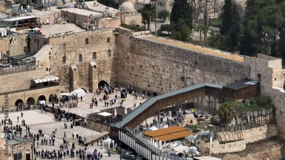 Paople praying at the Kotel western wall, Aerial view
Jerusalem at noon prayers from at the Western Wall plaza, 4K, march, 2023, drone view
Paople praying at the Kotel western wall, Aerial view
Jerusalem at noon prayers from at the Western Wall plaza, 4K, march, 2023, drone view