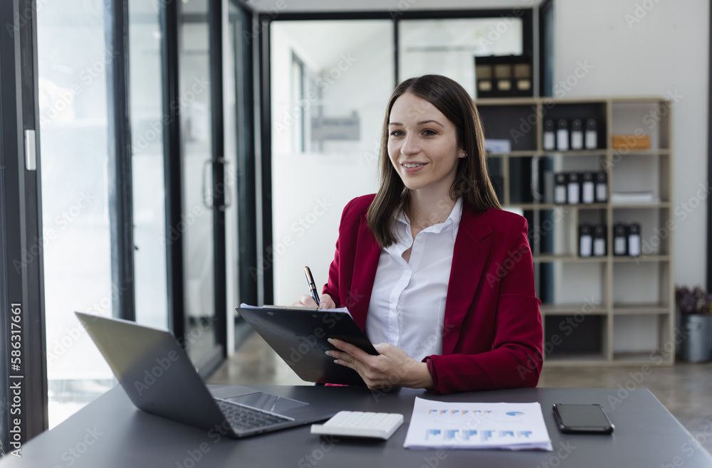 Businesswoman working and finance marketing chart, Advisor showing plan of investment to clients at table office. Digital marketing online concept. Businesswoman working and finance marketing chart, Advisor showing plan of investment to clients at table office. Digital marketing online concept.