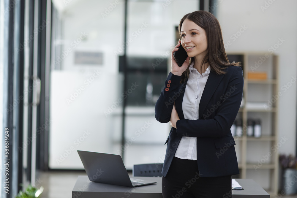 Young business woman using smartphone in the office, Business person and technology, Female using mobile phone, Young business woman using smartphone in the office, Business person and technology, Female using mobile phone,