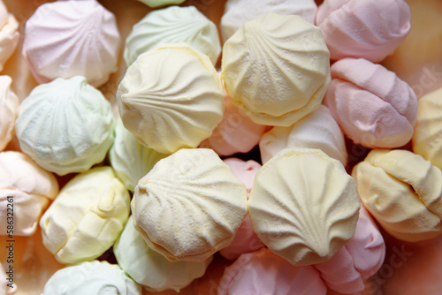 Fresh, sweet, multi-coloured marshmallows just cooked at a confectionery factory are sent for packing