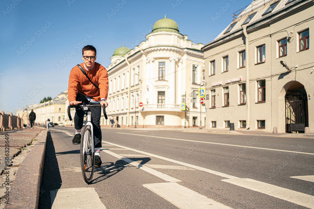 Male cyclist going to work, eco transport in the city.