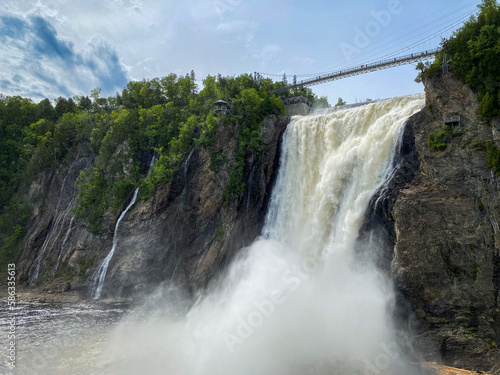 The Montmorency Falls (Chute Montmorency) large waterfall on Montmorency River where it drops into the Saint Lawrence River in Quebec, Canada. Protected within Montmorency Falls Park.