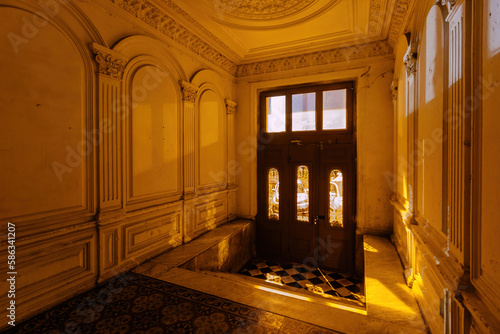 Entrance hall in old mansion at night