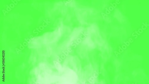 Boiling Pot Creates Hot Steam. Chroma key. White Steam rises from a large pot that is behind the scenes. Green background. Filmed at a speed of 120fps