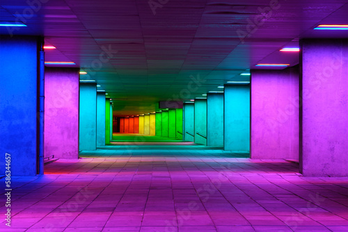 Colorful mulitcolord illuminated gallery tunnel rainbow passage under NAI building, Nederlands Architecture Institute near Museum Park, Rotterdam, The Netherlands photo