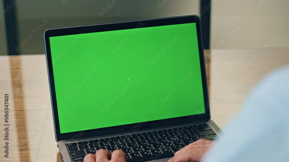 Boss using green screen laptop in office. Business man working mockup computer Boss using green screen laptop in office. Business man working mockup computer