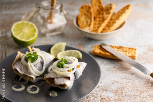 pickled herring on a plate.
