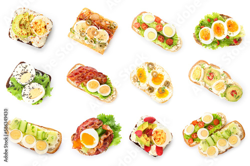 Collection of tasty toasts with boiled eggs on white background, top view