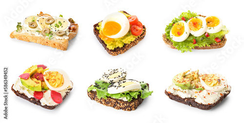 Collection of tasty toasts with boiled eggs on white background