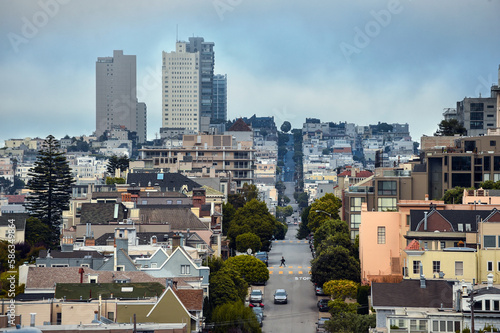 Aerial view of the beautiful streets of San Francisco with traffic of cars, people and impressive buildings 
