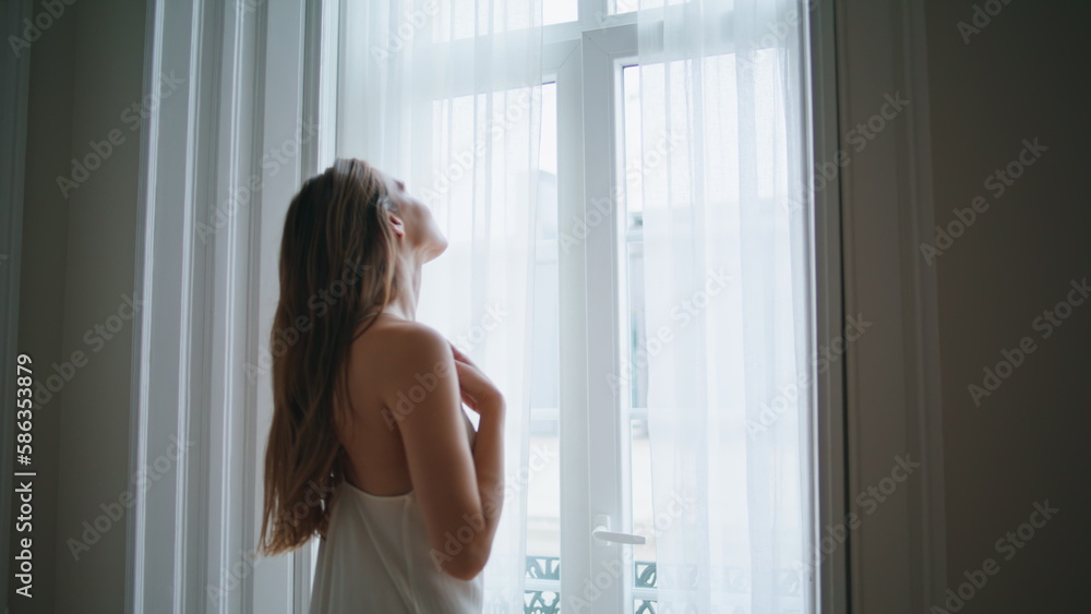 Sensual girl watching window bedroom close up. Tender woman relaxing at morning Sensual girl watching window bedroom close up. Tender woman relaxing at morning