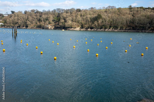 Yellow bouys on the Fowey river cornwall uk  photo