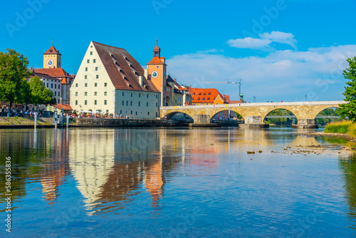 Old stone bridge over river Danube in Regensburg, Germany photo