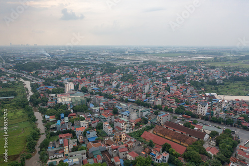 Aerial view of residential neighborhood roofs. Urban housing development from above. Top view. Real estate in Hanoi City, Vietnam. Property real estate.