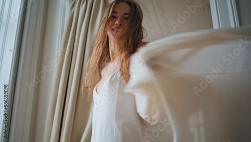 Free Download Smiling girl dancing cozy place closeup. Positive woman looking camera spinning - GFXLoad