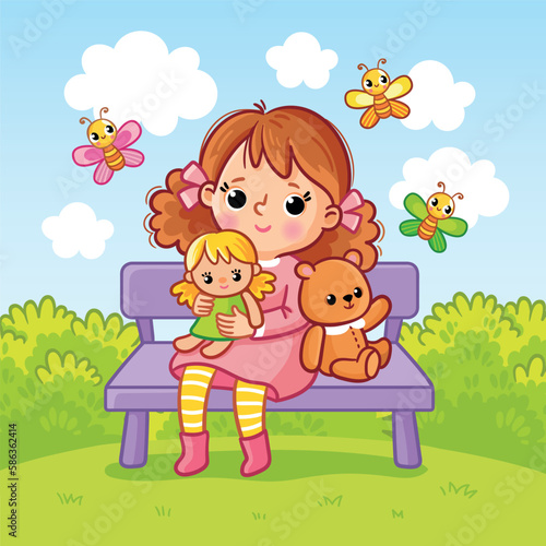 Cute little girl sits on a bench with toys.