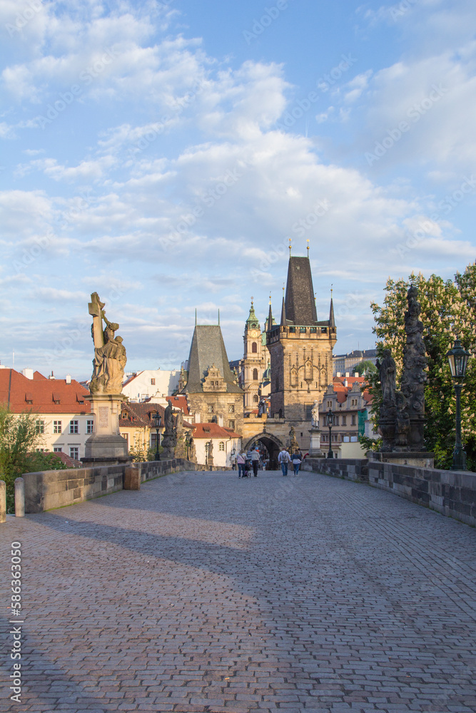 Obraz premium Beautiful view of the Malostranska tower of Charles Bridge at dawn in Prague, Czech Republic