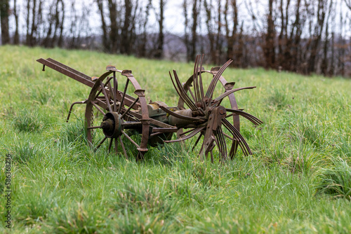 An old mechanical potato harvester. photo