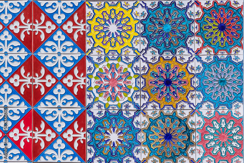 Colorfull traditional decorative tiles, known as asulejos, on a bulding in Lisbon. photo