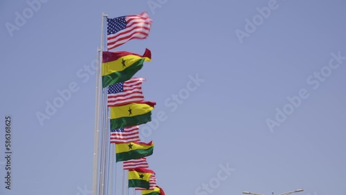American Vice President Kamala Harris on a tour of Ghana, Zambia and Tanzania. People holding flags. Ghana flags. American flags photo