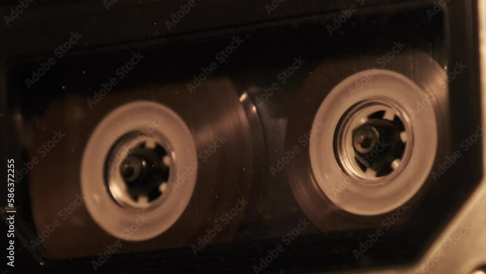 Audio cassette playback in a vintage tape recorder. Record player