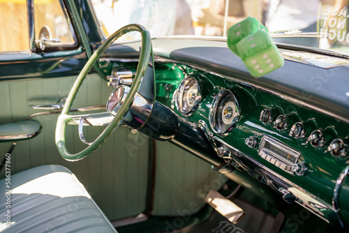 Interior view of a classic American car focus on steering wheel photo