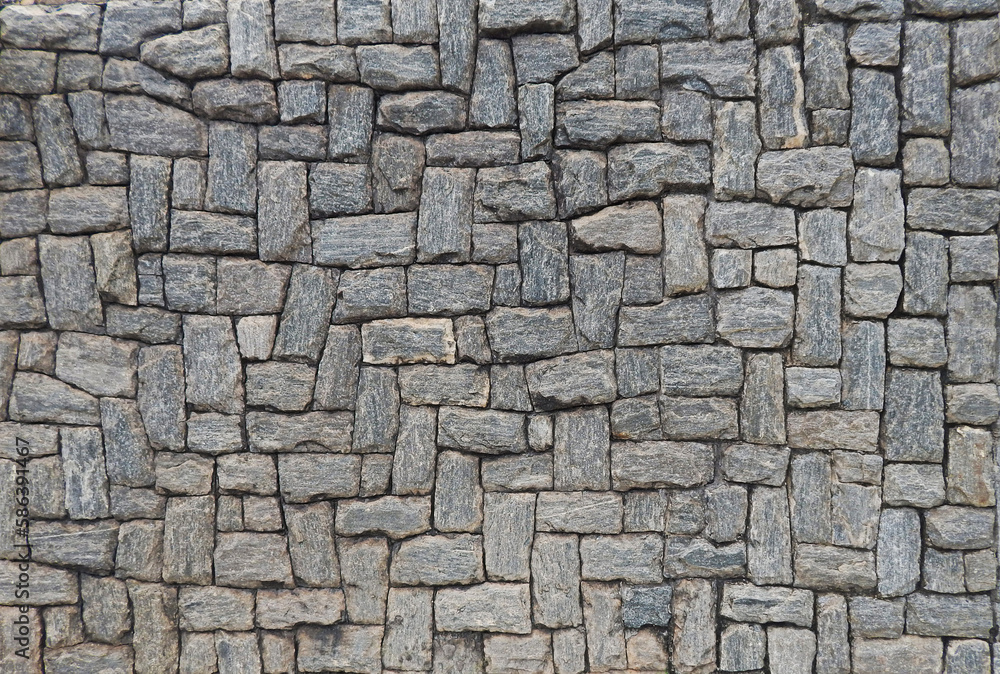 texture composed of ornamental gray stones in different tones and variable sizes, with irregular relief harmoniously arranged
