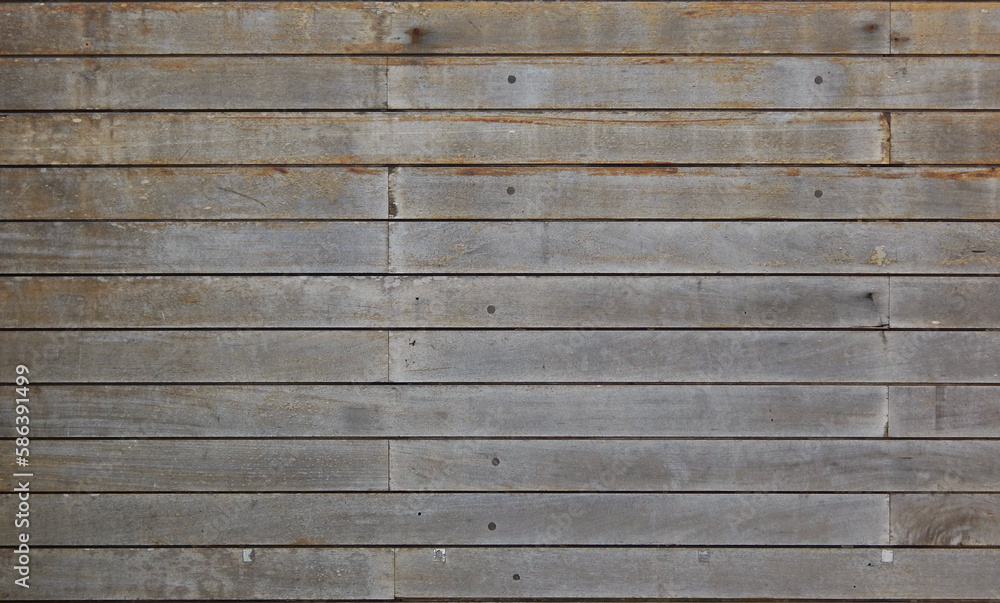 Texture formed by the composition of a panel of old and discolored wooden planks Texture formed by the composition of a panel of old and discolored wooden planks