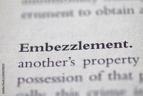 embezzlement printed in text on page as visual aid or business law reference photo