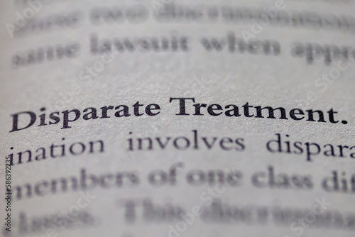 disparate treatment printed in text on page as visual aid or business law reference photo