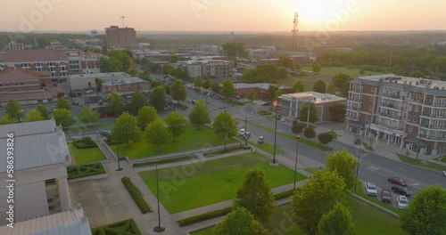 Aerial Forward Beautiful View Of Green Trees In Residential City Against Sky During Sunset - Tuscaloosa, Alabama photo