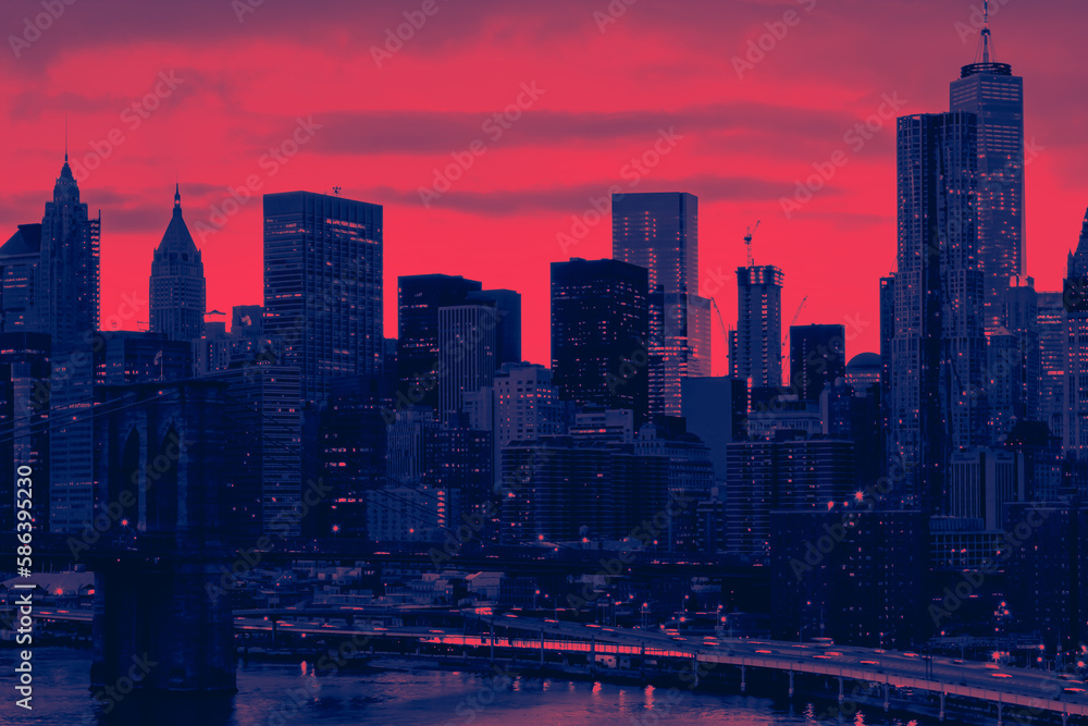 Colorful night lights shining with the Brooklyn Bridge and buildings of Manhattan in New York City with red and blue colors Colorful night lights shining with the Brooklyn Bridge and buildings of Manhattan in New York City with red and blue colors