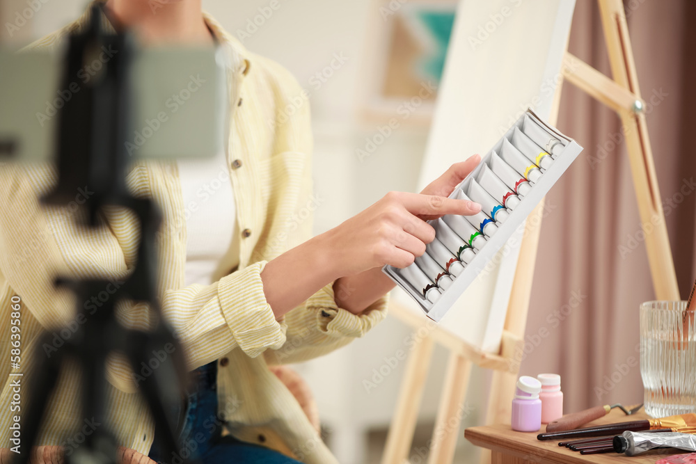 Obraz premium Teacher conducting online painting lesson at home, closeup. Time for hobby
