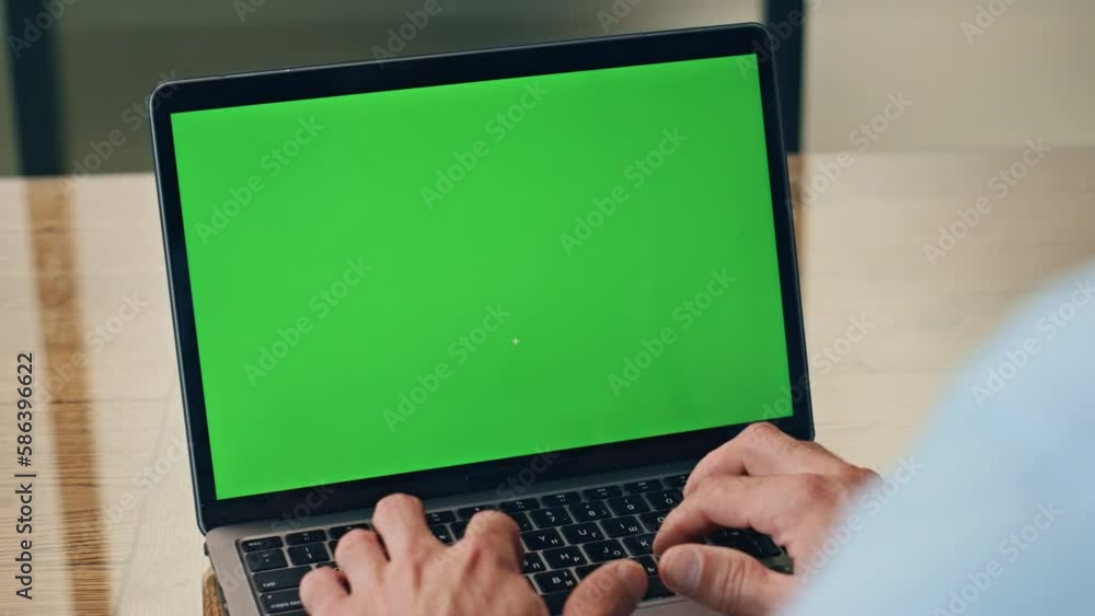 Man hands typing chromakey laptop at workplace closeup. Boss pushing buttons Man hands typing chromakey laptop at workplace closeup. Boss pushing buttons